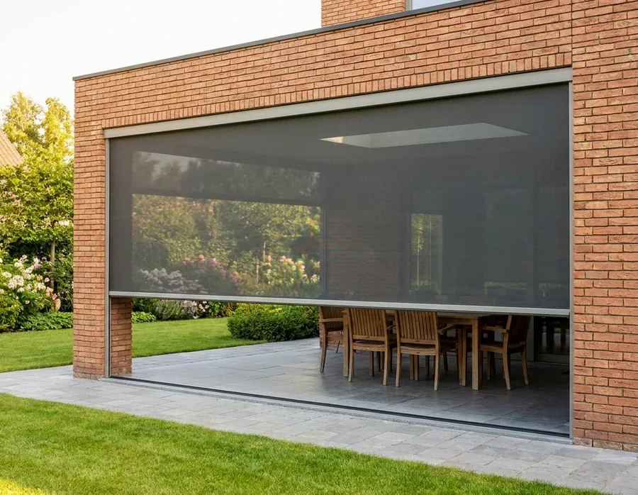 Zip screen mesh lowered across a patio opening, held taut in side channels